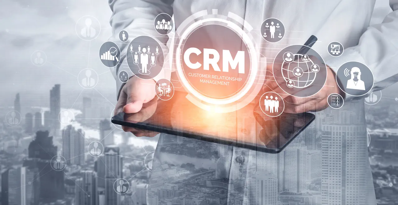 Image of a man holding a tablet with levitating CRM sign abover it on Awareness Strategies